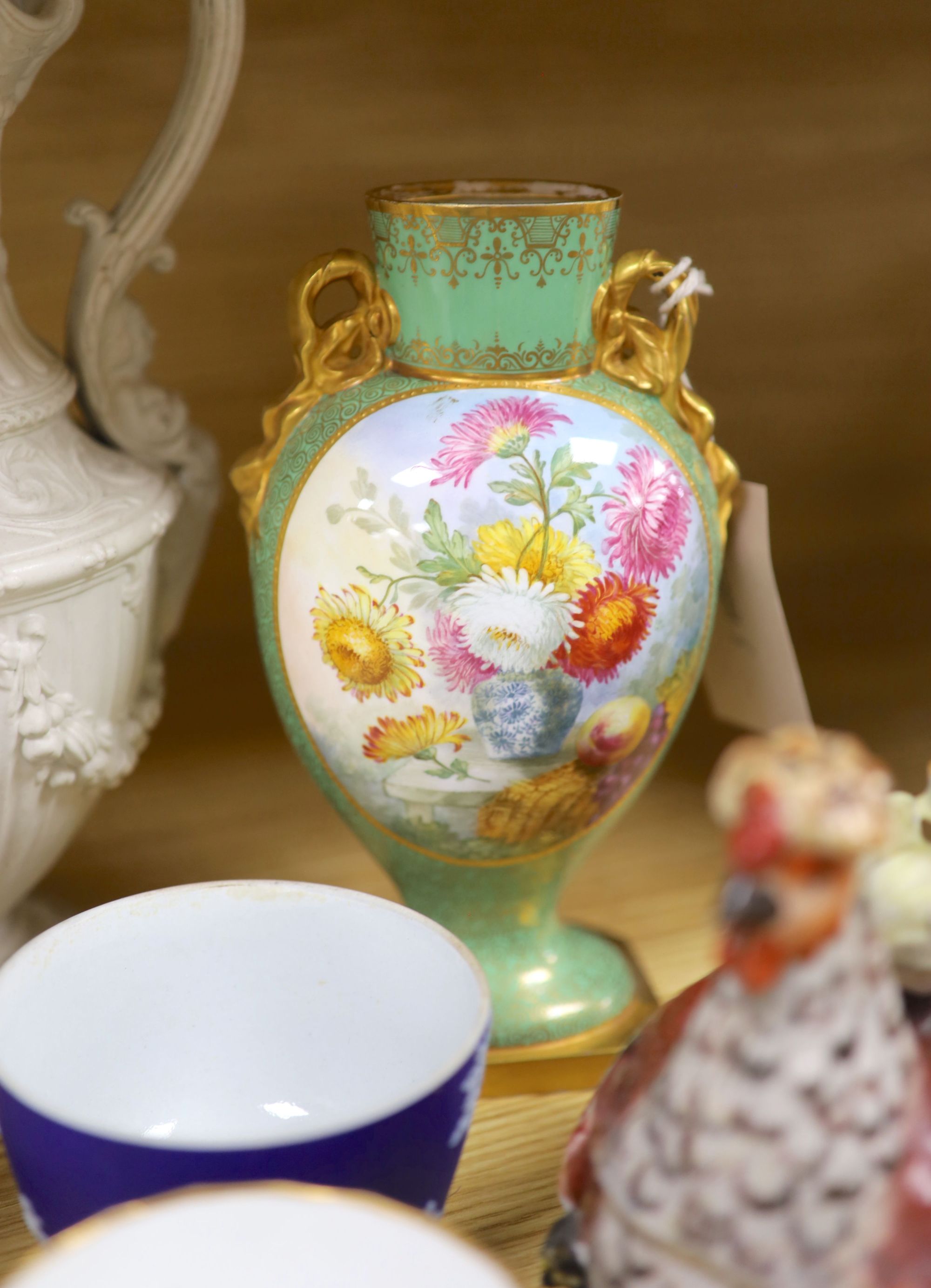 A group of mixed ceramics including a Copeland flower-painted vase, a Staffordshire hen and chick tureen and cover, Staffordshire cot